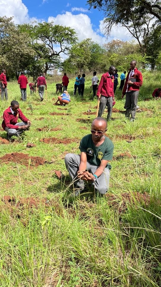 Mang'u High School student actively planting trees